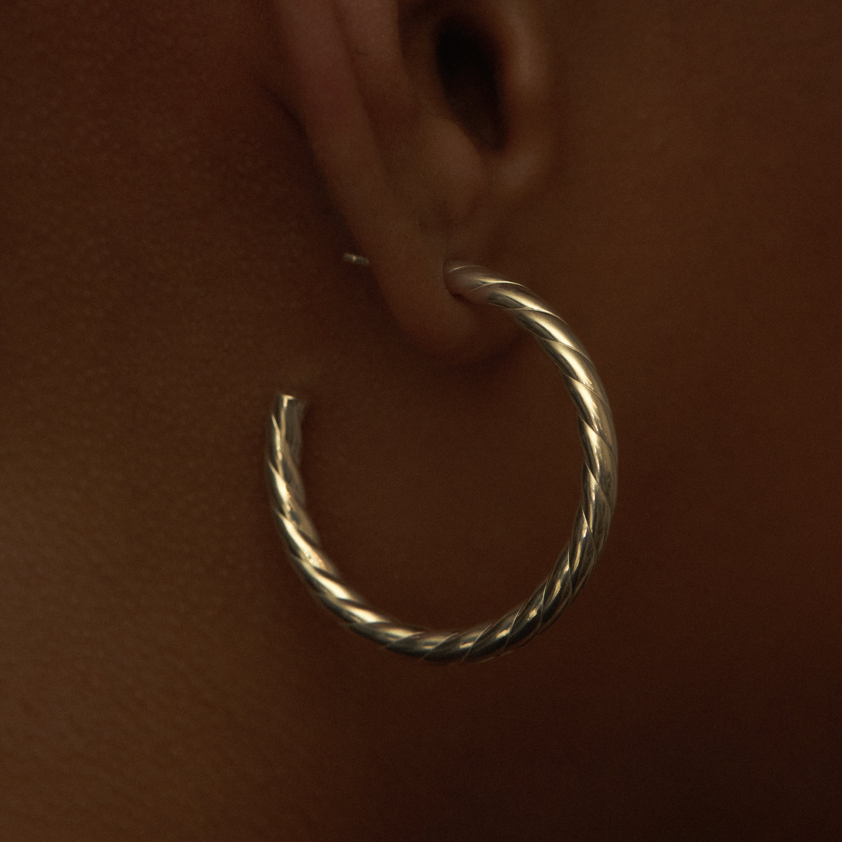 THE TWISTED HOOP EARRING